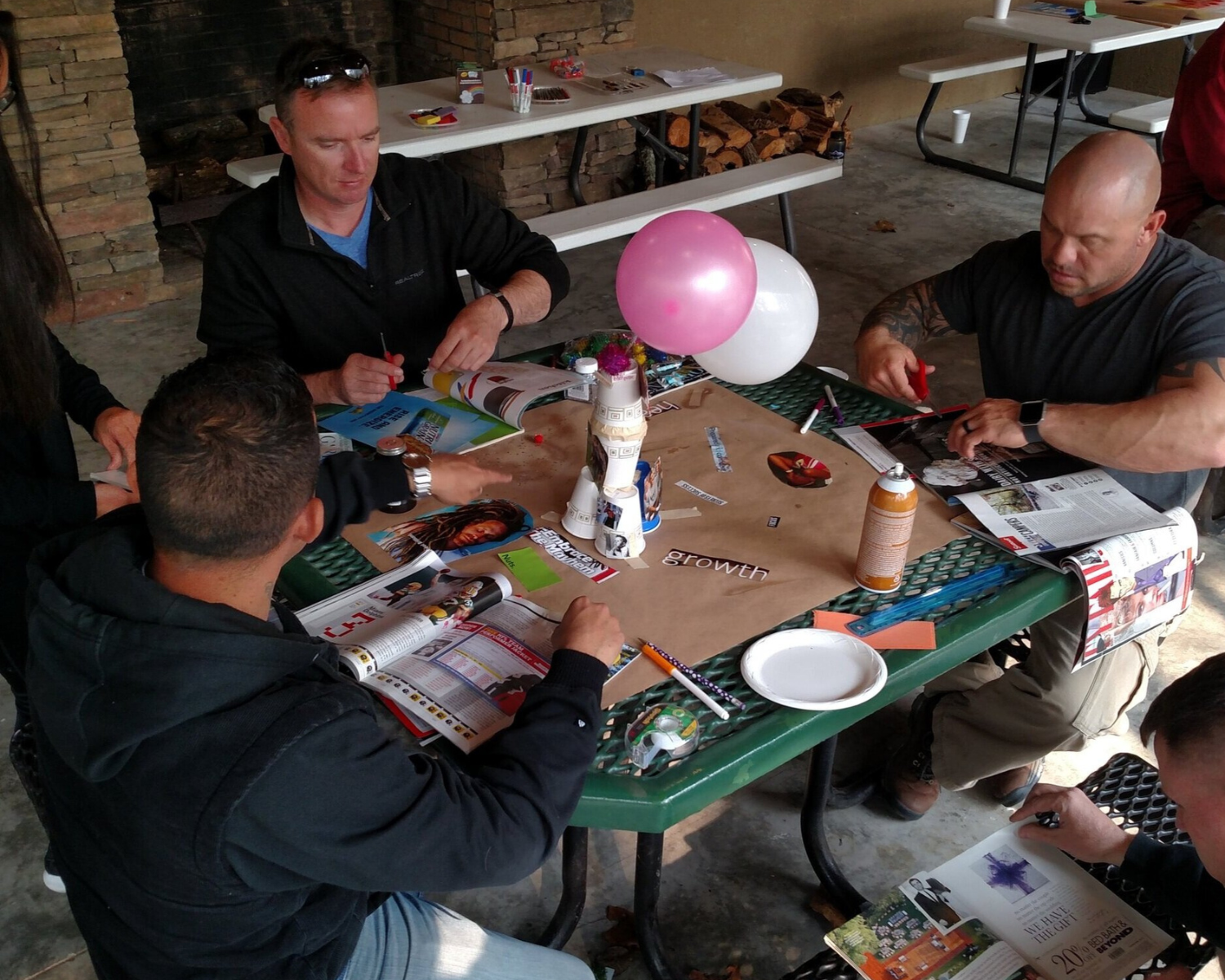 Three male veterans participating in the Healing Art class.