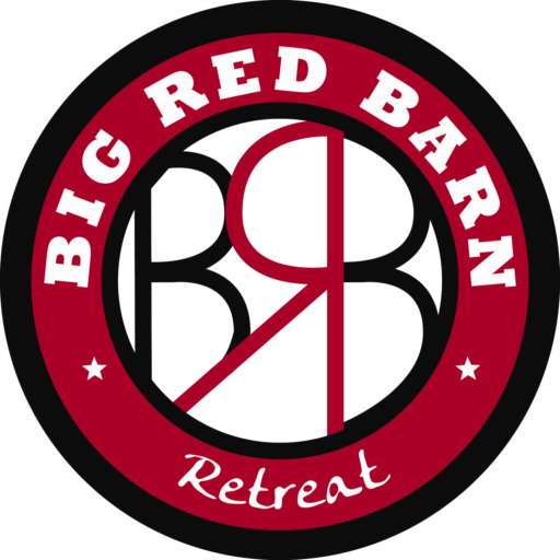 Big Red Barn Retreat logo is a red and black circle with the words going around and the letters in the center.