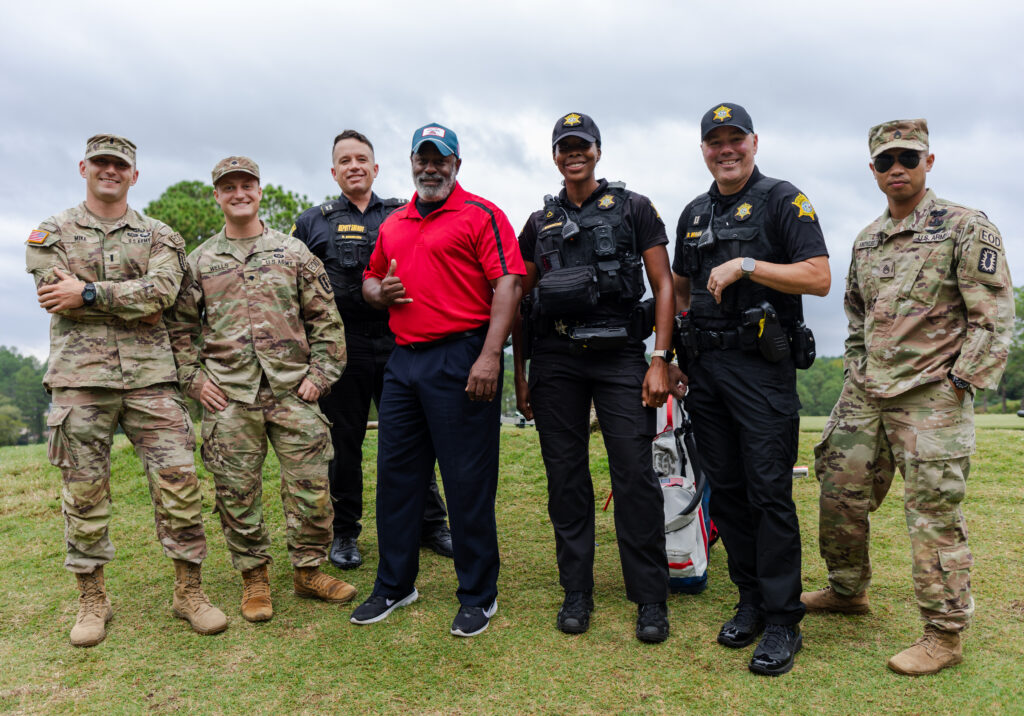 LAMONT CHRISTIAN WITH MILITARY AND POLICE OFFICERS
